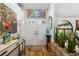 Bright entryway with double doors, modern decor, and lush plants at 5706 Bent Oak Dr, Sarasota, FL 34232