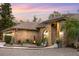 Brick home with landscaped entryway, featuring lighting and modern design at 5706 Bent Oak Dr, Sarasota, FL 34232