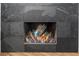 Stunning contemporary fireplace with colorful glass decor at 5706 Bent Oak Dr, Sarasota, FL 34232