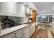 Modern kitchen with stainless steel appliances and light cabinets at 5706 Bent Oak Dr, Sarasota, FL 34232