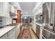 Modern kitchen with stainless steel appliances and light cabinets at 5706 Bent Oak Dr, Sarasota, FL 34232