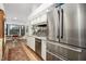 Modern kitchen with stainless steel appliances and light wood flooring at 5706 Bent Oak Dr, Sarasota, FL 34232
