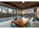 Relaxing poolside patio with wooden dining table and seating at 5706 Bent Oak Dr, Sarasota, FL 34232