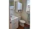 Clean bathroom featuring a toilet, sink, and storage at 5903 Todd St # E34, Bradenton, FL 34207