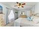 Spacious bedroom with beachy decor, wooden furniture, and ample natural lighting at 6336 7Th W Ave, Bradenton, FL 34209