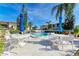 Community pool with lounge chairs, tables, and umbrellas at 6336 7Th W Ave, Bradenton, FL 34209