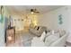 Living room with couch, ceiling fan, striped rug, and beach decor at 6336 7Th W Ave, Bradenton, FL 34209