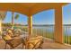 Relaxing balcony boasts stunning lake views and comfortable seating at 6482 Watercrest Way # 202, Lakewood Ranch, FL 34202