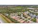 Aerial view of homes surrounding a lake in a peaceful community at 7134 Westhill Ct, Lakewood Ranch, FL 34202