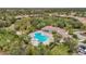 Community pool and clubhouse with surrounding homes at 7134 Westhill Ct, Lakewood Ranch, FL 34202