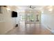 Spacious living room with tile flooring and French doors leading to the backyard at 7945 Palmer Blvd, Sarasota, FL 34240