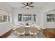 Bright dining room with a table set for six and wood flooring at 8162 Terrace Garden N Dr # 101, St Petersburg, FL 33709