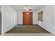 Dining area with built-in wooden hutch and carpet flooring at 8162 Terrace Garden N Dr # 101, St Petersburg, FL 33709