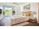 Modern bedroom featuring stylish furniture, decor, and natural light from the sliding glass doors at 850 S Tamiami Trl # 227, Sarasota, FL 34236