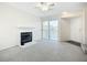 Living room with a fireplace and sliding glass doors to the outside at 850 S Tamiami Trl # 227, Sarasota, FL 34236