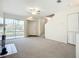 Living room with a sliding glass door with lake view at 850 S Tamiami Trl # 227, Sarasota, FL 34236