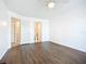 Spacious bedroom with wood flooring, and two entry doors to bathroom at 850 S Tamiami Trl # 227, Sarasota, FL 34236