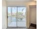 Enjoy serene water views from this condo's tiled patio with sliding glass doors at 850 S Tamiami Trl # 227, Sarasota, FL 34236
