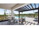 Relaxing pool area with covered seating and lounge chairs at 8964 Daybreak St, Sarasota, FL 34241