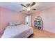 Bright bedroom features wood floors, a ceiling fan, and closet space at 9363 Steubenville Ave, Englewood, FL 34224