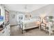 Bright bedroom with a bed, dresser and vanity at 944 Capri Isles Blvd # 201, Venice, FL 34292