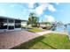 Large backyard with patio, canal access, and boat lift at 9820 Royal Palm Dr, Bradenton, FL 34210