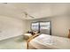 Main bedroom with a king bed and a comfortable chaise lounge at 9820 Royal Palm Dr, Bradenton, FL 34210