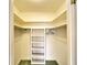 Spacious closet with shelves and hanging rods at 9820 Royal Palm Dr, Bradenton, FL 34210