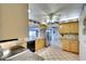 Kitchen with granite countertops and light wood cabinets at 9820 Royal Palm Dr, Bradenton, FL 34210