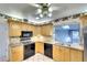Bright kitchen features granite countertops, wood cabinets, and modern appliances at 9820 Royal Palm Dr, Bradenton, FL 34210