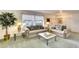 Bright living room with two sofas, end tables, and a coffee table at 9820 Royal Palm Dr, Bradenton, FL 34210