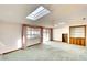 Living area with water views, skylights, and built-in shelving at 9820 Royal Palm Dr, Bradenton, FL 34210