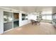 Covered patio with fans and access to the backyard at 9820 Royal Palm Dr, Bradenton, FL 34210