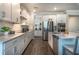 Bright kitchen with white cabinets, quartz countertops, and stainless steel appliances at 9904 Wild Begonia Loop, Land O Lakes, FL 34637