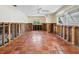 Room under renovation with tiled floors and exposed framing at 1221 S Basin Ln, Sarasota, FL 34242