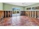 Room with tiled floors and sliding glass doors to the outside at 1221 S Basin Ln, Sarasota, FL 34242