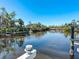 Calm waterway with neighboring houses and boats at 1221 S Basin Ln, Sarasota, FL 34242