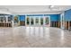 Large living area undergoing renovation, new windows and flooring at 1221 S Basin Ln, Sarasota, FL 34242