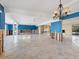 Living room with blue walls, tile flooring and chandelier at 1221 S Basin Ln, Sarasota, FL 34242