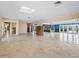 Spacious living room with tile floors and large windows at 1221 S Basin Ln, Sarasota, FL 34242