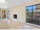 Living area with fireplace and large windows at 1221 S Basin Ln, Sarasota, FL 34242