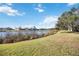 Lush backyard featuring a scenic lake view, perfect for relaxation and outdoor activities at 12343 Lavender Loop, Bradenton, FL 34212