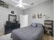 Comfortable bedroom with ceiling fan, dresser with record player, and bed at 12343 Lavender Loop, Bradenton, FL 34212