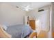 Comfortable bedroom with a ceiling fan, dresser, and full-sized bed at 12343 Lavender Loop, Bradenton, FL 34212