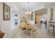 Inviting breakfast nook features natural light, a charming table and chairs, and a view of the outdoors at 12343 Lavender Loop, Bradenton, FL 34212