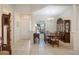 Bright dining room with chandelier, tile floors and view of the front yard at 12343 Lavender Loop, Bradenton, FL 34212