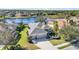 Beautiful waterfront home with a three-car garage and well-manicured lawn at 12343 Lavender Loop, Bradenton, FL 34212