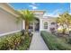 Charming front entrance with beautiful landscaping, pillars, and a welcoming walkway at 12343 Lavender Loop, Bradenton, FL 34212