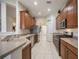 Well-equipped kitchen with stainless steel appliances, ample cabinet space, and tile flooring at 12343 Lavender Loop, Bradenton, FL 34212