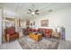 Spacious living room with comfortable seating, a ceiling fan, and neutral decor at 12343 Lavender Loop, Bradenton, FL 34212